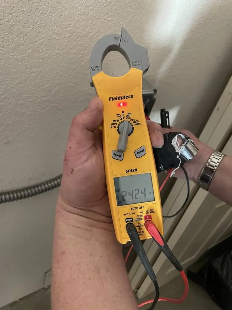 Voltage testing with clamp meter during Ceiling Fan Installation in Sugarland Run